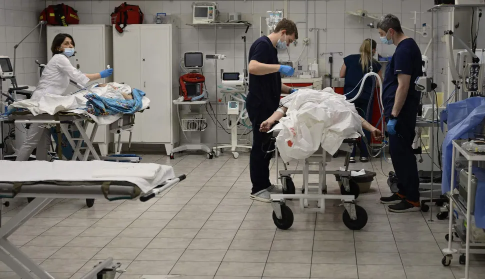 Medics examine the incoming patients in the preoperative room of the traumatology department of the Mechnikov Hospital in the city of Dnipro on June 8, 2026, amid the Russian invasion of Ukraine. Since Russia invaded in 2022, the hospital has become the main centre for both soldiers and civilians wounded across east and southern Ukraine. The flow of victims has been constant, but the type of injuries has changed. (Photo by Genya SAVILOV/AFP)
