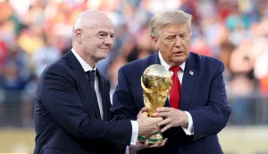 EAST RUTHERFORD, NEW JERSEY - JULY 19: U.S. President Donald Trump and FIFA President Gianni Infantino hold the FIFA World Cup Winner's Trophy before handing over to captain Rodri #16 of Spain at the award ceremony following the FIFA World Cup 2026 Final match between Spain and Argentina at New York New Jersey Stadium on July 19, 2026 in East Rutherford, New Jersey. Carl Recine/Getty Images/AFP (Photo by Carl Recine/GETTY IMAGES NORTH AMERICA/Getty Images via AFP)