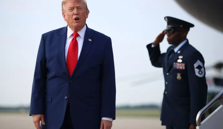 JOINT BASE ANDREWS, MARYLAND - JULY 22: U.S. President Donald Trump calls out to reporters after getting off Air Force One on July 22, 2026 at Joint Base Andrews, Maryland. Trump is returning from attending a dignified transfer at Dover Air Force Base and a rally in Georgia. Kevin Dietsch/Getty Images/AFP (Photo by Kevin Dietsch/GETTY IMAGES NORTH AMERICA/Getty Images via AFP)