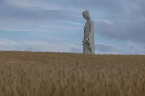 A statue of the Virgin Mary is seen over the field in Konotopie village, next to Torun, central Poland on July 22, 2026. In a nondescript village in northern-central Poland, a statue of the Virgin Mary, towers above what residents hope is the traditionally Catholic country's newest pilgrimage destination. At 55 meters high, the concrete and steel beam figure in Konotopie is the tallest Marian statue in Europe, and second in the world. (Photo by Wojtek RADWANSKI/AFP)