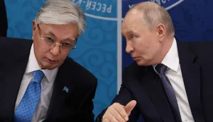 In this pool photograph distributed by the Russian state agency Sputnik, Russia's President Vladimir Putin (R) speaks to Kazakhstan's President Kassym-Jomart Tokayev as they attend the 22nd Russia-Kazakhstan Forum of Interregional Cooperation in Omsk on July 25, 2026. (Photo by Vyacheslav PROKOFYEV/POOL/AFP)