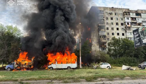 This handout photograph taken and released by the State Emergency Service of Ukraine on July 21, 2026 shows a fire at the site of an air strike in the town of Zaporizhzhia, amid the Russian invasion of Ukraine. During the day, Russian forces launched guided glide bombs at central Zaporizhzhia. Two local residents were killed and nine others were injured according to Zaporizhzhia military administration. One glide bomb landed near a printing house, setting parked cars on fire. Another bomb struck near a nine-storey apartment building, sparking a fire that engulfed the building. (Photo by Handout/STATE EMERGENSY SERVICE OF UKRAINE/AFP)/RESTRICTED TO EDITORIAL USE - MANDATORY CREDIT "AFP PHOTO/STATE EMERGENCY SERVICE OF UKRAINE" - HANDOUT - NO MARKETING NO ADVERTISING CAMPAIGNS - DISTRIBUTED AS A SERVICE TO CLIENTS