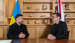 Britain's Prime Minister Andy Burnham (R) and Ukraine's President Volodymyr Zelensky (L) speak at their bilateral meeting during their visit to HM Naval Base in Portsmouth on the south coast of England on July 27, 2026. Ukrainian President Volodymyr Zelensky arrived in Britain on July 27 to meet Prime Minister Andy Burnham, who used his first bilateral with a foreign leader to underline London's "unwavering support" for Kyiv. (Photo by Simon Jones/POOL/AFP)