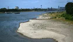 The partially dried-up river bed of the Rhine pictured in Cologne, western Germany, on July 6, 2026, following exceptionally hot weather. (Photo by Ina FASSBENDER/AFP)