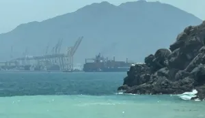 This frame grab taken from AFPTV video footage on July 12, 2026 shows a ship sailing near the Strait of Hormuz off the eastern coast of the United Arab Emirates at Khor Fakkan. Tehran announced it was closing the Strait of Hormuz on July 12 and launched missiles and drones at its Gulf neighbours, in retaliation for new US strikes following an attack by Iranian forces on a merchant vessel that was abandoned in flames by its crew. (Photo by AFPTV/AFP)/Attention editors: AFP covers the war in the Middle East through its extensive regional network, including bureaus in Tehran, Jerusalem and several neighboring countries.Since the start of the conflict, journalists have been working under increasingly restrictive conditions. Authorities in several countries have limited reporters? movements, photo and live video coverage from sensitive locations. Some governments and armed groups have banned images of missile or drone strikes and other security-related sites./