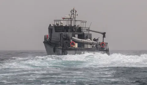 A vessel of the navy of Yemen's Aden-based internationally recognised government patrols a shipping lane off Hanish Island in the Red Sea on July 27, 2026. A Houthi spokesman said on July 24 that the rebels were not blocking traffic through the strategic Bab al-Mandeb Strait, after they declared a maritime embargo this week on their foe Saudi Arabia. The Iran-backed group attacked a Saudi ship in the nearby Red Sea after announcing the blockade, which threatens the top oil exporter's ability to get its supplies to the world following Iran's parallel blockade of the Strait of Hormuz, the kingdom's only other maritime route. (Photo by Khaled ZIAD/AFP)/