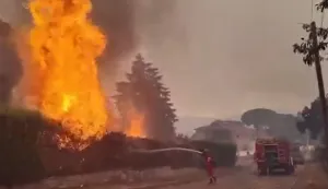 This screengrab from a video posted on the X account of Spain's Military Emergencies Unit UME (@UMEgob) on July 23, 2026, shows UME personnel fighting a wildfire in San Mart?n de Valdeiglesias, Madrid. In Spain, a fire broke out on July 22 afternoon in Almorox, near Toledo, southwest of Madrid, leading to the evacuation of several municipalities in the area and the lockdown of one of them, emergency services announced on X. Reflecting the rapid spread of the fire, authorities and emergency services twice sent an alert message to all mobile phones in the area to warn of the situation. (Photo by Handout/X account of Spain's Military Emergencies Unit UME (@UMEgob)/AFP)/RESTRICTED TO EDITORIAL USE - MANDATORY CREDIT "AFP PHOTO/X account of Spain's Military Emergencies Unit UME (@UMEgob)/HANDOUT" - NO MARKETING NO ADVERTISING CAMPAIGNS - DISTRIBUTED AS A SERVICE TO CLIENTS