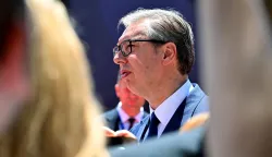 Serbia's President Aleksandar Vucic walks through a crowd of journalists as he arrives at an EU-Western Balkans Summit at Porto Montenegro in Tivat on June 5, 2026. (Photo by ELVIS BARUKCIC/AFP)