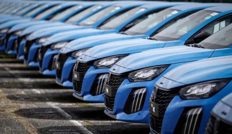 (FILES) Peugeot cars are seen parked outside the Stellantis multinational car manufacturer's plant in Poissy, west of Paris, on April 15, 2026. New car sales jumped 11.4% year-on-year in June, in a market that still has not returned to its pre-Covid-19 pandemic level, according to preliminary data released on July 1, 2026 by the Automotive Platform (PFA). (Photo by Simon Wohlfahrt/AFP)