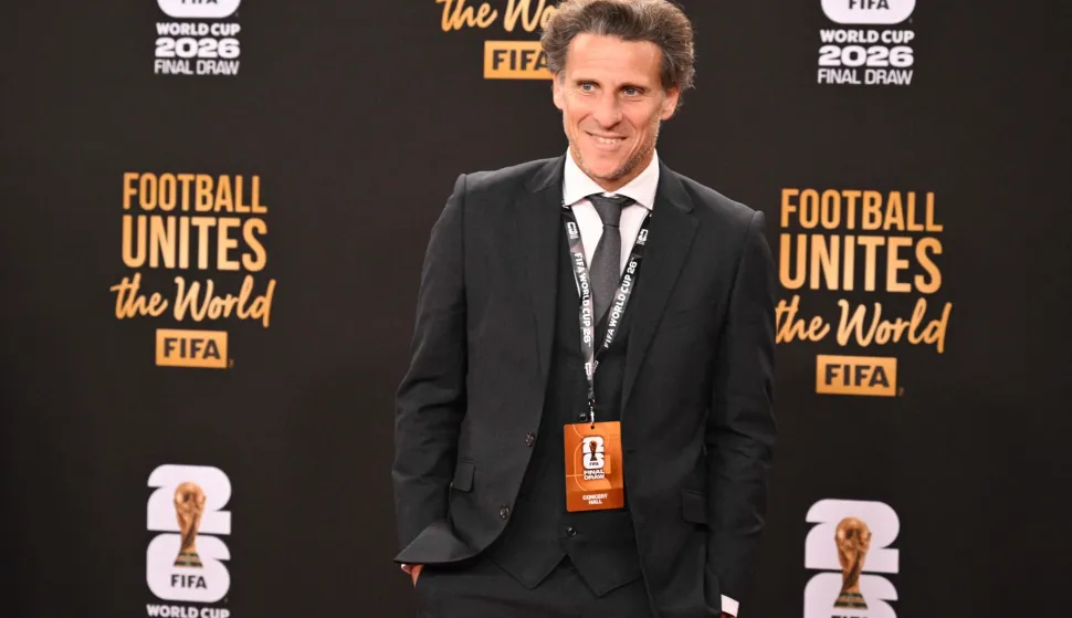 (FILES) Uruguay's former player Diego Forlan poses on the red carpet upon arrival to attend the draw for the 2026 FIFA Football World Cup taking place in the US, Canada and Mexico, at the Kennedy Center, in Washington, DC, on December 5, 2025. Diego Forlan is to take over as head coach of Uruguay?s national team and their Under-20 side, the Uruguayan Football Association (AUF) announced on August 6, 2026, less than two months after the team were knocked out in the group stage of the World Cup under Marcelo Bielsa. (Photo by Roberto SCHMIDT/AFP)