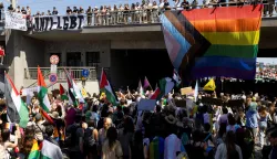 Participants hold Palestinian flags as people attend the Prague Pride Parade where thousands march through the city center in support of LGBTQ+ rights, in Prague, Czech Republic, August 8, 2026. REUTERS/Eva Korinkova Photo: EVA KORINKOVA/REUTERS