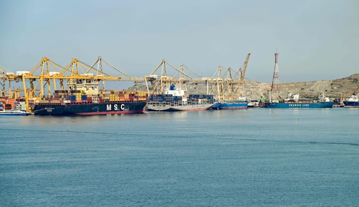 (L to R) The Liberia-flagged container vessel MSC Tasman VI, the Singapore-flagged container vessel Wan Hai 353, and other ships are docked along a pier at the Khor Fakkan Container Terminal, the only natural deep-sea port in the region and one of the major container ports in Sharjah Emirate, along the Gulf of Oman on June 19, 2026. Mediators in the US-Iran conflict, including Pakistan, Saudi Arabia and Turkey, are due to gather for talks in Egypt on June 21. A deal signed earlier in the week by US President Donald Trump and his Iranian counterpart Masoud Pezeshkian, aims to end the conflict that began on February 28 with US-Israeli strikes on Iran. It also provides for the reopening of the Strait of Hormuz and the launch of a 60-day negotiation period on broader issues, including Tehran's nuclear programme. (Photo by AFP)/