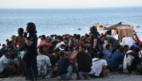Hundreds of migrants receive medical care from staff of Spain's National Institute for Healthcare Management (INGESA) and Red Cross volunteers on Trampol&iacute;n Beach in Ceuta, Spain on August 7, 2026, as healthcare and food are distributed under coordination by the National Police's riot squad. Photo by Gabriela Sard&aacute; N&uacute;&ntilde;ez/Europa Press/ABACAPRESS.COM Photo: Europa Press/ABACA/ABACA