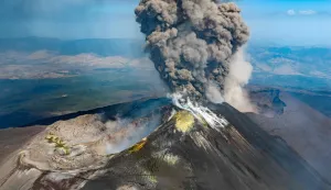 A plum of ashes rises from a crater of the Mount Etna volcano during an eruption on July 30, 2026. (Photo by Giuseppe Distefano/Etna Walk/AFP)