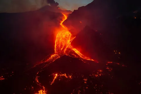 A drone view shows molten lava flowing down the slope during an eruption at Mount Etna in Sicily, Italy, August 11, 2026. Giuseppe Di Stefano/Etna Walk/via REUTERS ATTENTION EDITORS - THIS IMAGE WAS PROVIDED BY A THIRD PARTY. Photo: Giuseppe Di Stefano/Etna Walk/REUTERS