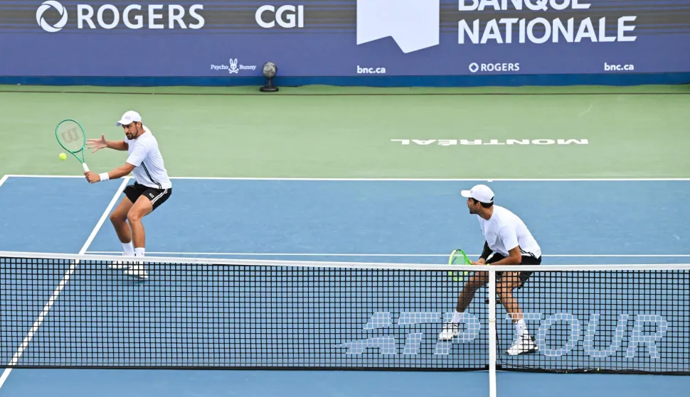 MONTREAL, CANADA - AUGUST 10: Marcelo Arevalo of El Salvador and Mate Pavic of Croatia compete against Duncan Chan and Alexis Galarneau of Canada during their doubles Quarterfinals match on day nine of the ATP 1000 National Bank Open presented by Rogers at Stade IGA on August 10, 2026 in Montreal, Quebec, Canada. Minas Panagiotakis/Getty Images/AFP (Photo by Minas Panagiotakis/GETTY IMAGES NORTH AMERICA/Getty Images via AFP)