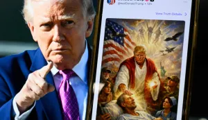 This photo illustration created on April 13, 2026 shows a picture of US President Donald Trump on a screen and an AI-generated picture he posted on his Truth Social platform depicting himself as Jesus Christ after criticizing Pope Leo XIV. Trump later posted an AI-generated image seemingly depicting himself as Jesus Christ. In the image, the president appears dressed in red and white robes as he cures a man with his healing hand. The American flag is shown over his shoulder. Trump and the White House have previously shared AI-generated images, including one that showed the president dressed as the pope. (Photo by Mandel NGAN/AFP)