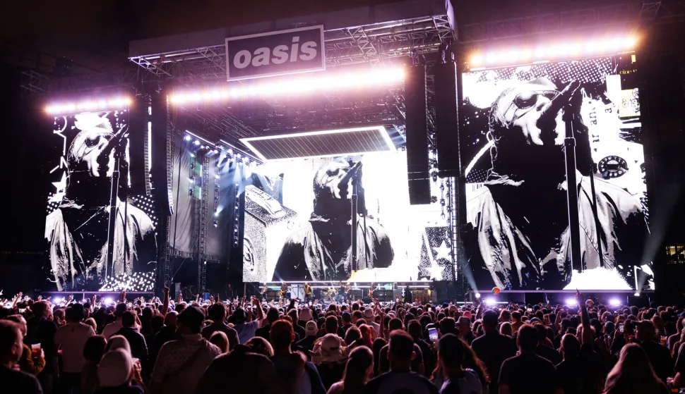 Fans watch Oasis perform at Soldier Field on Aug. 28, 2025, in Chicago. (Photo by Armando L. Sanchez/Chicago Tribune/TNS/Sipa USA) Photo: TNS/SIPA USA