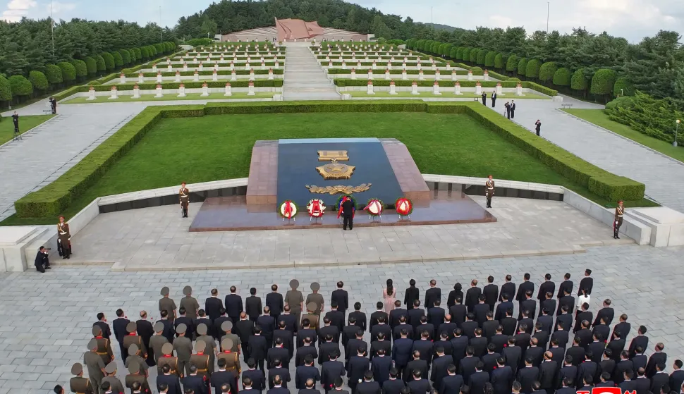 This picture taken on August 14, 2026 and released by North Korea's official Korean Central News Agency (KCNA) via KNS on August 15, 2026 shows North Korean leader Kim Jong Un (C) visiting the Taesongsan Revolutionary Martyrs Cemetery in Pyongyang, and laying flowers to mark the 81st anniversary of the end of World War II. (Photo by Handout/KCNA/AFP)/- South Korea OUT/---EDITORS NOTE--- RESTRICTED TO EDITORIAL USE - MANDATORY CREDIT "AFP PHOTO/KCNA VIA KNS" - NO MARKETING NO ADVERTISING CAMPAIGNS - DISTRIBUTED AS A SERVICE TO CLIENTSTHIS PICTURE WAS MADE AVAILABLE BY A THIRD PARTY. AFP CAN NOT INDEPENDENTLY VERIFY THE AUTHENTICITY, LOCATION, DATE AND CONTENT OF THIS IMAGE. THIS PHOTO IS DISTRIBUTED EXACTLY AS RECEIVED BY AFP./