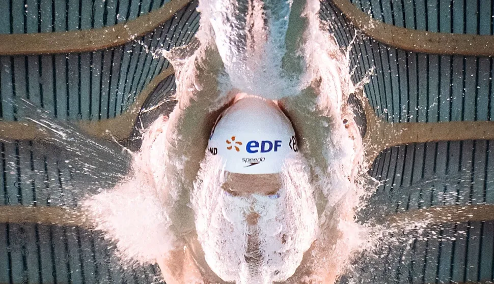 France's swimmer Leon Marchand competes during the final of the men's 200m butterfly swimming event during the LEN European Aquatics Championships at the Olympic Aquatic Centre in Saint-Denis, northern suburbs of Paris, on August 15, 2026. (Photo by S?bastien BOZON/AFP)