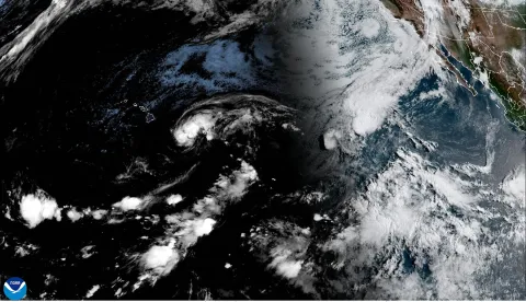 This handout satellite image from the National Oceanic and Atmospheric Administration (NOAA) shows Tropical Storm Lala over the Pacific Ocean as it moves toward Hawaii?s main island at 15:20 GMT on August 14, 2026. A strengthening tropical storm named Lala is set to hit Hawaii's Big Island with hurricane force on Saturday, bringing dangerous winds, rainfall and surf as the state's governor declared a state of emergency. (Photo by Handout/NOAA/AFP)/RESTRICTED TO EDITORIAL USE - MANDATORY CREDIT "AFP PHOTO/NOAA/HANDOUT" - NO MARKETING NO ADVERTISING CAMPAIGNS - DISTRIBUTED AS A SERVICE TO CLIENTS