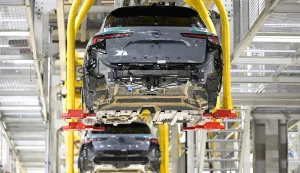 (FILES) Opel Astra passenger cars are transported automatically to their next production step at the company?s plant in Ruesselsheim, western Germany, on June 30, 2026. German carmaker Opel has long dominated the city of Ruesselsheim along the Rhine River, but in a sign of the times of Europe's struggling carmakers, the brand is turning to partnership with Chinese carmaker Leapmotor while slashing its own German engineering ranks. (Photo by Florian WIEGAND/AFP)