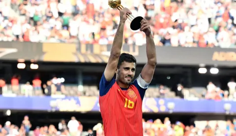 Spain's midfielder #16 Rodri lifts his most valuable player trophy at the end of the 2026 World Cup football tournament final match between Spain and Argentina at the New York/New Jersey Stadium in East Rutherford on July 19, 2026. (Photo by Mandel NGAN/AFP)