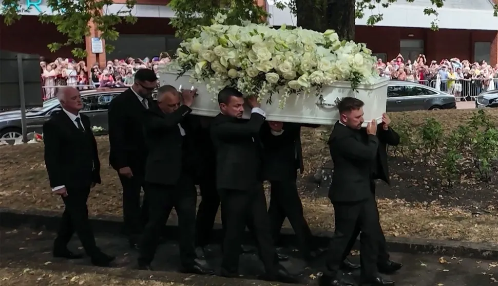 This video grab taken from an AFPTV video shows pallbearers carrying the casket of Welsh singer Bonnie Tyler as it arrives at St. Mary's Church for a "celebration of life" ceremony in Swansea, Wales on August 17, 2026. Welsh singer Bonnie Tyler, best known for her hit love song "Total Eclipse of the Heart", died in Portugal in July 2026 at the age of 75. (Photo by Lidia PEDRO/AFPTV/AFP)