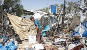 A displaced Palestinian youth inspects the damage at the site of an alleged Israeli strike on a tent in Khan Yunis, in the southern Gaza Strip, on August 16, 2026. US President Donald Trump's envoy and son-in-law Jared Kushner discussed Trump's Gaza plan with Egyptian President Abdel Fattah al-Sisi on August 16, hours after Hamas chief Khalil El-Hayya met with Egypt's spy chief. Kushner is set to travel next to Israel, which has publicly rejected a 15-point plan in which Hamas agreed to hand over its weapons to a new Palestinian governing committee in Gaza. (Photo by Bashar Taleb/AFP)