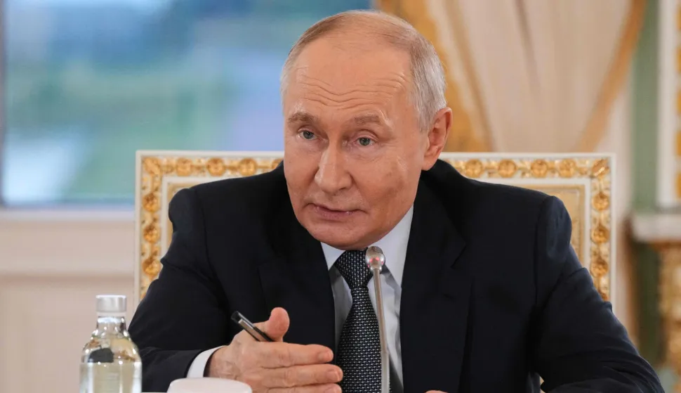 Russian President Vladimir Putin speaks during a meeting with representatives of international news agencies on the sidelines of the St. Petersburg International Economic Forum at the Constantine Palace in Saint Petersburg on June 4, 2026. (Photo by Dmitry LOVETSKY/POOL/AFP)