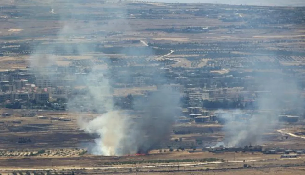 epa06051426 Smoke rise from Syrian village as a result of fighting near the city of Quneitra, in the Golan Heights, as seen from the Israeli side of the border, 26 June 2017. Israeli army reported a heavy machine gun bullets hit the position of United Nations Disengagement Observer Force (UNDOF), adjacent to the border with Syria. On 24 June an Israeli army spokesman reported that in response to over ten projectiles launched from Syrian soil which hit Israel, Israeli aircraft targeted the position from which the launches originated and struck tanks belonging to the Syrian regime in the Northern Syrian Golan Heights. EPA/ATEF SAFADI