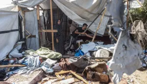 Displaced Palestinians inspect the damage at the site of an alleged Israeli strike on a tent in Khan Yunis, in the southern Gaza Strip, on August 16, 2026. US President Donald Trump's envoy and son-in-law Jared Kushner discussed Trump's Gaza plan with Egyptian President Abdel Fattah al-Sisi on August 16, hours after Hamas chief Khalil El-Hayya met with Egypt's spy chief. Kushner is set to travel next to Israel, which has publicly rejected a 15-point plan in which Hamas agreed to hand over its weapons to a new Palestinian governing committee in Gaza. (Photo by Bashar Taleb/AFP)