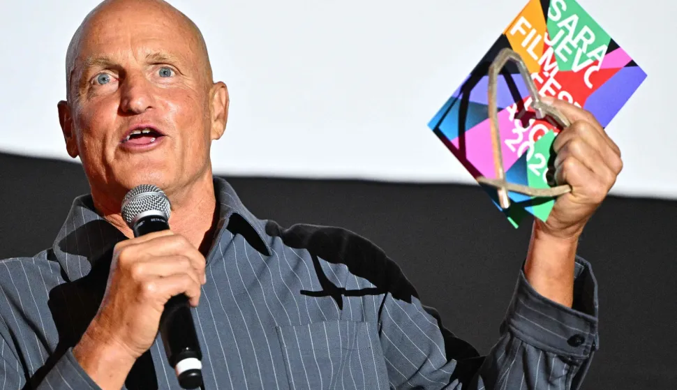 US actor Woody Harrelson speaks on stage with his "Heart Of Sarajevo" award at the 32nd Sarajevo Film Festival in Sarajevo, Bosnia and Herzegovina, on August 18, 2026. (Photo by ELVIS BARUKCIC/AFP)