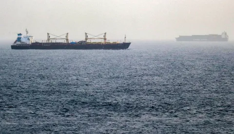Vessels transit the Bab el-Mandeb Strait off the coast of southern Yemen on July 25, 2026. A spokesman for Yemen's Houthis had said on July 24 that the rebels were not blocking traffic through the strategic Bab al-Mandeb Strait, after they declared a maritime embargo this week on their foe Saudi Arabia. The Iran-backed group attacked a Saudi ship in the nearby Red Sea after announcing the blockade, which threatens the top oil exporter's ability to get its supplies to the world following Iran's parallel blockade of the Strait of Hormuz, the kingdom's only other maritime route. (Photo by Khaled ZIAD/AFP)/