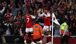 Arsenal's German midfielder #29 Kai Havertz celebrates scoring the team's first goal with Arsenal's English midfielder #07 Bukayo Saka during the English Premier League football match between Arsenal and Coventry City at the Emirates Stadium in London on August 21, 2026. (Photo by Henry NICHOLLS/AFP)/RESTRICTED TO EDITORIAL USE. No use with unauthorized audio, video, data, fixture lists, club/league logos or 'live' services. Online in-match use limited to 120 images. An additional 40 images may be used in extra time. No video emulation. Social media in-match use limited to 120 images. An additional 40 images may be used in extra time. No use in betting publications, games or single club/league/player publications./