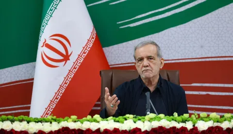 A handout photo made available by the Iranian Presidential Office shows Iran's President Masoud Pezeshkian gesturing as he speaks during a press conference in the capital Tehran, on August 8, 2026. Oman said on August 8, that negotiations with Iran about the future administration of the Strait of Hormuz were "positive and constructive", but warned against repeated attacks on shipping as Tehran pressed its blockade of the vital waterway. (Photo by Iranian Presidential Office/AFP)/