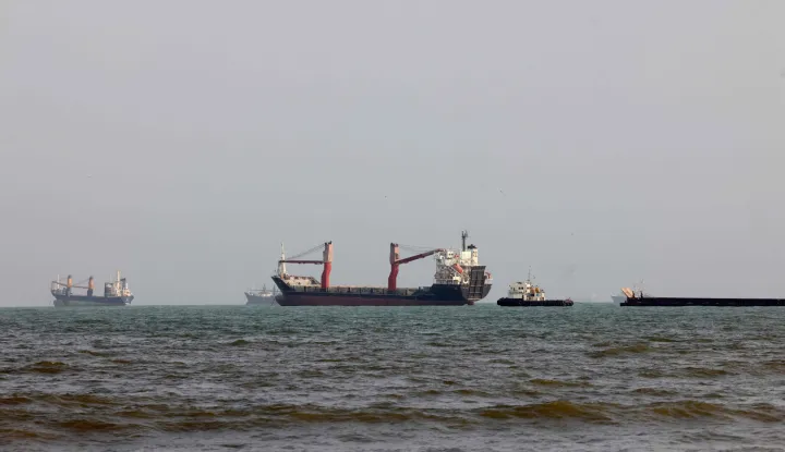 Vessels are seen in the Strait of Hormuz, off the port city of Bandar Abbas in southern Iran on August 10, 2026. The US President signalled on August 9 that he was prepared to let economic pressure mount against Iran, apparently backing away from more military strikes after Tehran issued a list of demands for opening the Strait of Hormuz. His remarks came after Iran issued over the weekend a list of conditions to reopen the Strait of Hormuz, which has remained largely closed since the start of the Middle East war in late February. (Photo by Atta KENARE/AFP)/