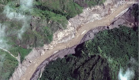 This handout satellite image taken and released by Vantor on August 27, 2026 shows the Trishuli River in Nepal after flash floods and landslides hit the area. Rescue teams waded through mud on August 27, 2026 searching for more than 1,400 people missing after flash floods and landslides struck the Nepal-Tibet border on August 26, 2026, sweeping entire villages away. (Photo by Handout/Satellite image ?2026 Vantor/AFP)/RESTRICTED TO EDITORIAL USE - MANDATORY CREDIT "AFP PHOTO/Satellite image ?2026 Vantor" - HANDOUT - NO MARKETING NO ADVERTISING CAMPAIGNS - DISTRIBUTED AS A SERVICE TO CLIENTS - THE WATERMARK MAY NOT BE REMOVED/CROPPED