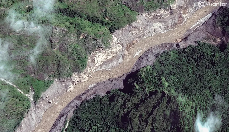This handout satellite image taken and released by Vantor on August 27, 2026 shows the Trishuli River in Nepal after flash floods and landslides hit the area. Rescue teams waded through mud on August 27, 2026 searching for more than 1,400 people missing after flash floods and landslides struck the Nepal-Tibet border on August 26, 2026, sweeping entire villages away. (Photo by Handout/Satellite image ?2026 Vantor/AFP)/RESTRICTED TO EDITORIAL USE - MANDATORY CREDIT "AFP PHOTO/Satellite image ?2026 Vantor" - HANDOUT - NO MARKETING NO ADVERTISING CAMPAIGNS - DISTRIBUTED AS A SERVICE TO CLIENTS - THE WATERMARK MAY NOT BE REMOVED/CROPPED
