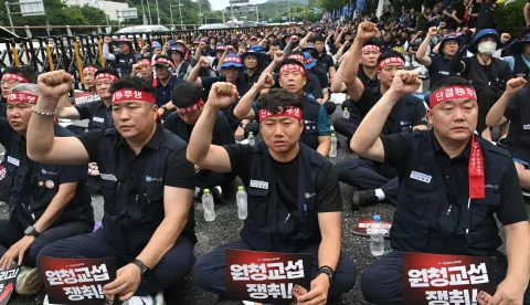 Members of the Korean Metal Workers' Union shouts slogans during a joint strike rally in front of the Hyundai Motor headquarters in Seoul on August 21, 2026. The union representing workers at South Korean automaker Hyundai Motor staged its first full-day strike in 10 years on August 21, after long-running wage and retirement age talks with management broke down. (Photo by Jung Yeon-je/AFP)