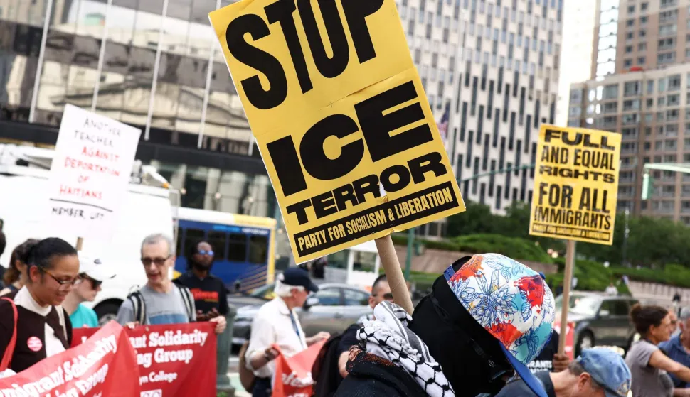 A person holds a sign reading "Stop ICE terror" as people rally during a protest against the termination of Temporary Protected Status (TPS) for the Haitian community and to end mass deportations, at Foley Square in New York City on August 28, 2026. The Supreme Court said in late June 2026 that the Trump administration is allowed to end Temporary Protected Status (TPS) for Haitians and some 6,000 Syrians without judicial review, although the impact of the decision could apply to migrants from many other backgrounds. An estimated 350,000 Haitians live in the United States under the program, with many working in healthcare and construction. (Photo by CHARLY TRIBALLEAU/AFP)