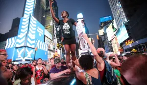 NEW YORK, NY - JULY 14: Trayvon Martin supporters rally in Times Square while blocking traffic after marching from a rally for Martin in Union Square in Manhattan on July 14, 2013 in New York City. George Zimmerman was acquitted of all charges in the shooting death of Martin July 13 and many protesters questioned the verdict.  Mario Tama/Getty Images/AFP== FOR NEWSPAPERS, INTERNET, TELCOS & TELEVISION USE ONLY ==