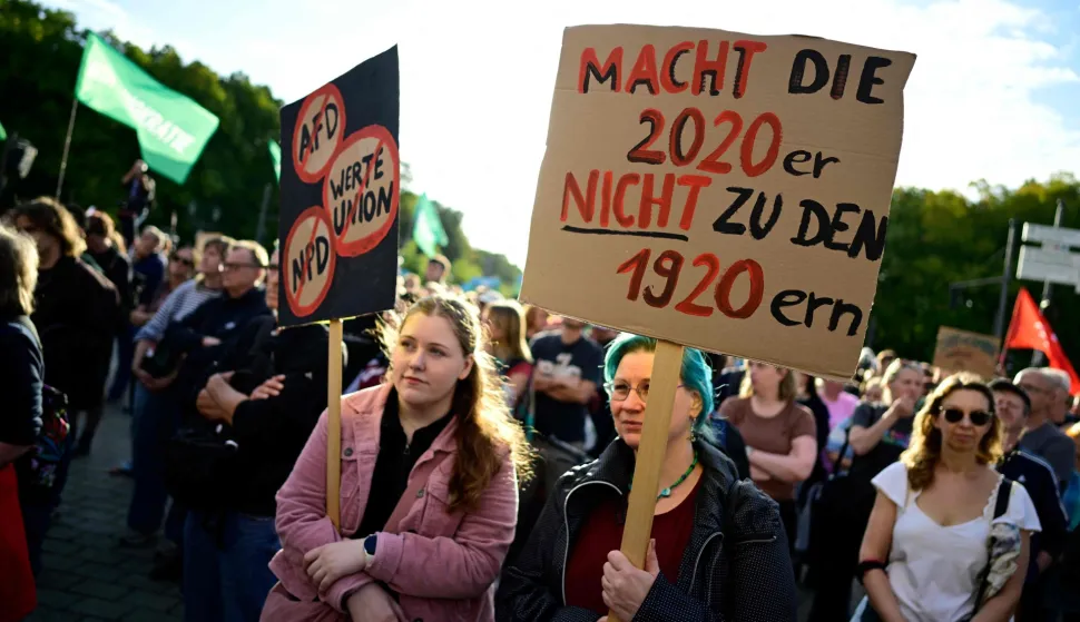People protest and hold a placard reading "Don?t turn the 2020s into the 1920s" during a rally called by the organizations Campact and Fridays for Future named ?Time to Act: Stop the AfD!" in Berlin on September 7, 2026, one day after regional elections in the eastern federal state of Saxony-Anhalt. (Photo by John MACDOUGALL/AFP)