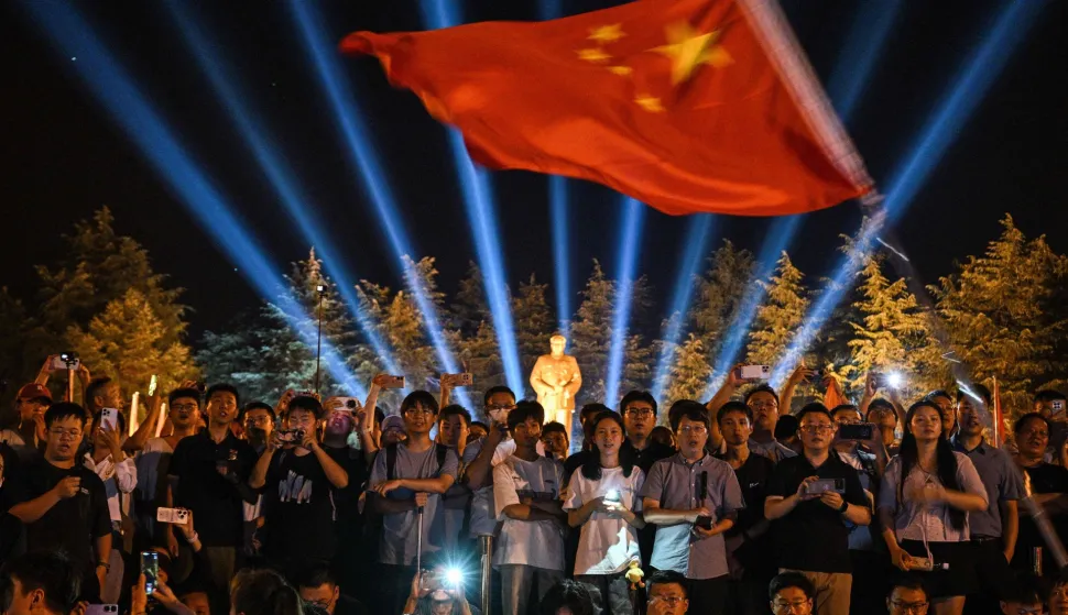 People gather to pay tribute to late Communist leader Mao Zedong at the Bronze Statue Square in Shaoshan, China's central Hunan province on September 8, 2026, a day before the 50th anniversary of his death. (Photo by Hector RETAMAL/AFP)