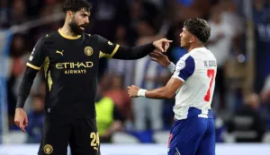 Manchester City's Croatian defender #24 Josko Gvardiol points at FC Porto's Brazilian forward #07 William Gomes during the UEFA Champions League first round day 1 football match between FC Porto and Manchester City at Dragao stadium in Porto on September 8, 2026. (Photo by PATRICIA DE MELO MOREIRA/AFP)