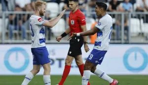 12.09.2026., stadion Opus Arena, Osijek - SuperSport HNL 2026./2027., 07. kolo, NK Osijek - GNK Dinamo. Nogometasi Osijeka slave pogodak Luke Vrbancica za vodstvo 3:0. Luka Vrbancic i Armando Leon Photo: Davor Javorovic/PIXSELL