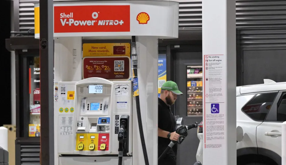 A driver fills his vehicle up with gas in Los Angeles, California on September 8, 2026. Oil prices climbed to near $100 a barrel in Asian morning trade, as the flare-up threatened to further choke supply from the crude-rich Middle East. (Photo by Frederic J. BROWN/AFP)