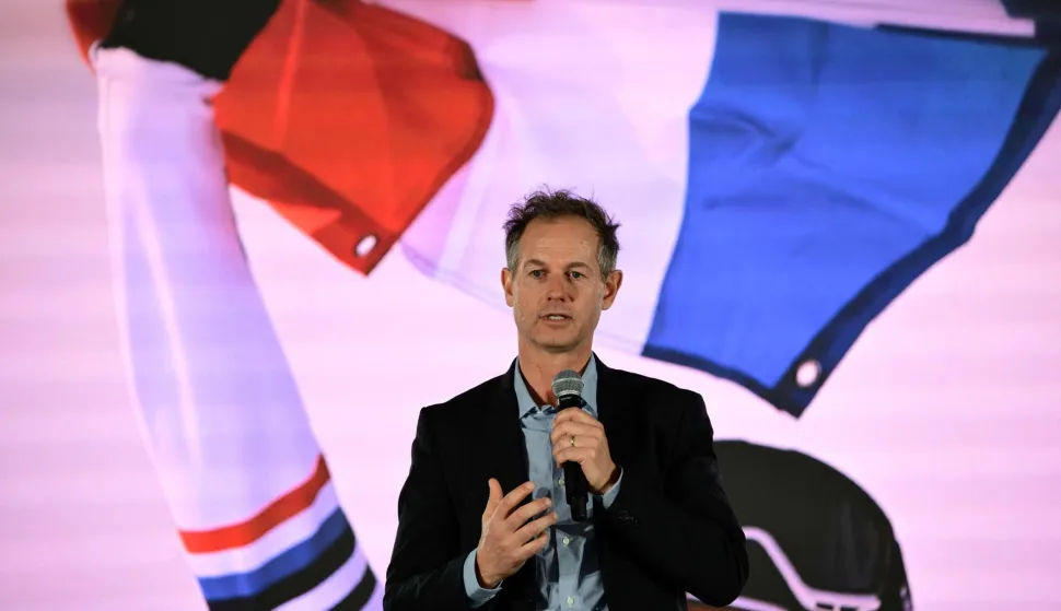(FILES) Former French freestyle skier and new president of the Organizing Committee for the French Alps 2030 Olympic and Paralympic Winter Games, Edgar Grospiron speaks at a press conference at the Groupama Stadium in D?cines-Charpieu, near Lyon, on February 18, 2025. The organising committee for the 2030 Winter Olympic and Paralympic Games announced on September 10, 2026 the resignation of its president, Edgar Grospiron, who was weighed down by a severe governance crisis. (Photo by OLIVIER CHASSIGNOLE/AFP)