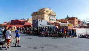 Unadmitted migrants wait outside the new Los Rosales migrant reception camp, where more than 800 people have been transferred from the Loma Colmenar camp, in Ceuta, on September 12, 2026. More than 70,000 migrants streamed into Ceuta from neighbouring Morocco on July 30 and 31, in an unprecedented rush that left scores dead. Thousands remain in the small city, increasing tensions with increasingly frustrated locals who demand their expulsion and a return to normality. The crisis has generated a constant churn of negative headlines and dominated the political debate for six weeks. (Photo by Antonio Sempere/AFP)