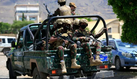 Yemen's Houthi armed forces patrol as Yemeni prisoners loyal to the Houthi authorities arrive in the capital Sanaa on September 12, 2026, after being released on the west coast where he and others were being held by Yemen's Saudi-backed government forces. Some 210 prisoners were released following a week-long offensive, in which the Iran-backed Houthis on September 11, 2026, captured Yemen's Red Sea coast from the internationally recognised government, cementing their hold on the Bab al-Mandab Strait, a vital artery for Saudi Arabian oil exports as the Strait of Hormuz remains closed amid the US-Iran war. (Photo by Mohammed HUWAIS/AFP)HUTISTI, JEMEN